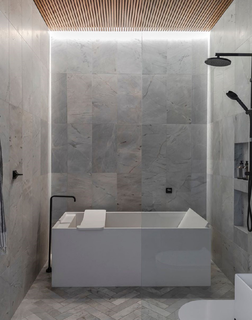 apaiser soka petit freestanding bath in a grey bathroom